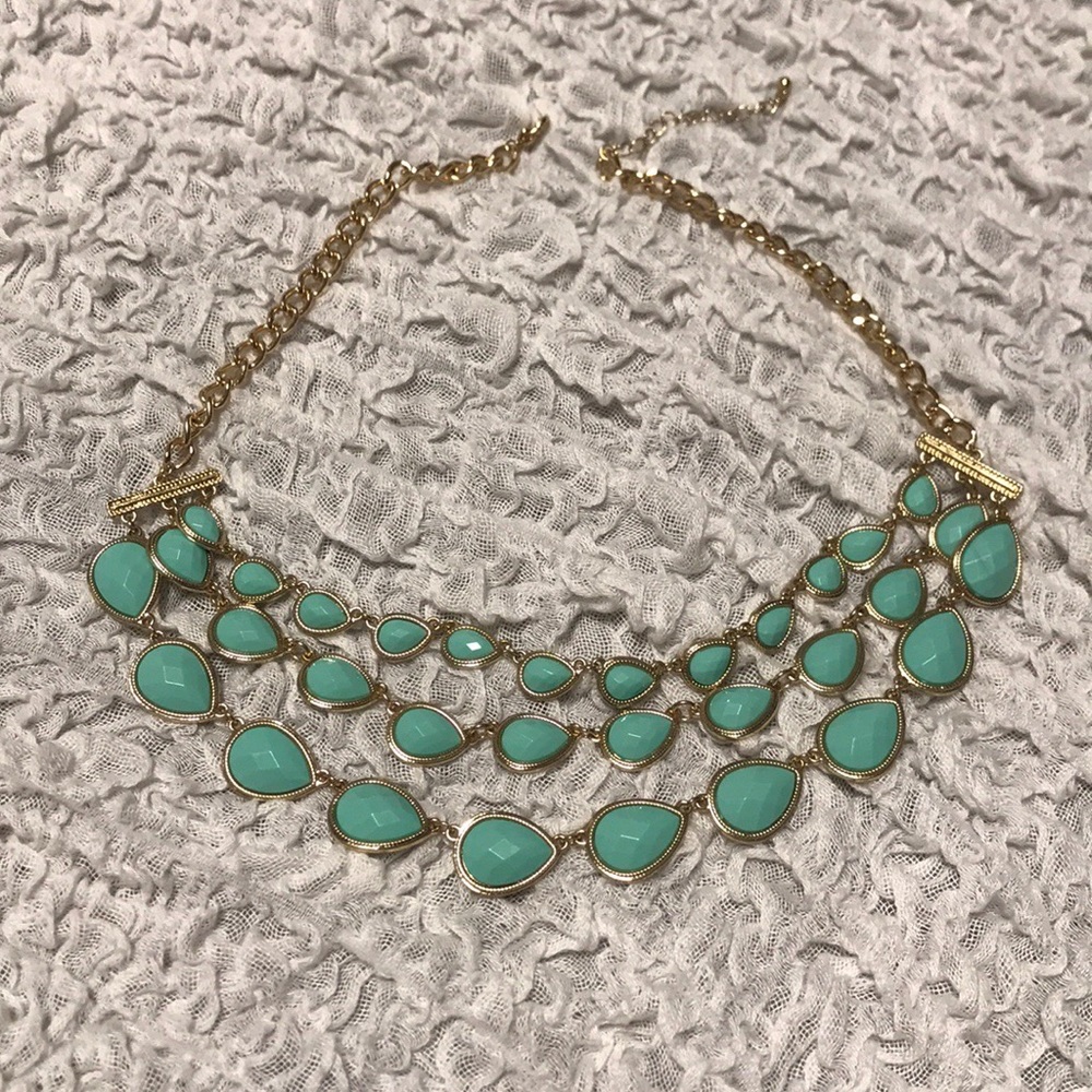 Blue rhinestone necklace with gold colored chain